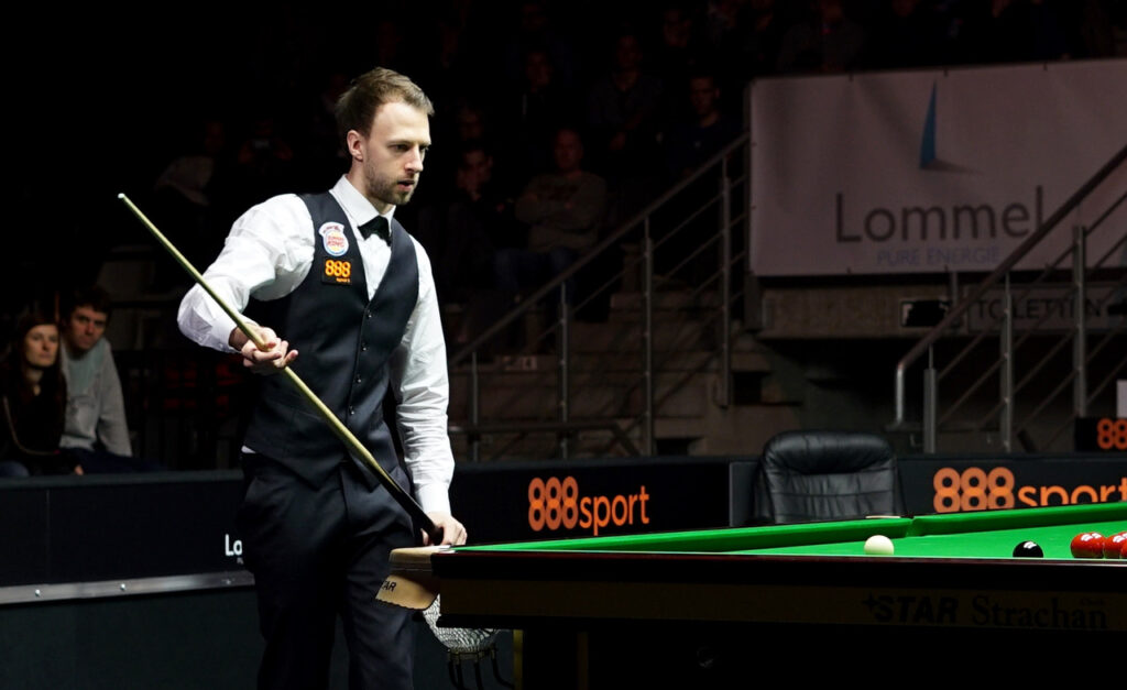 Judd Trump prepares to play snooker shot in Belgium